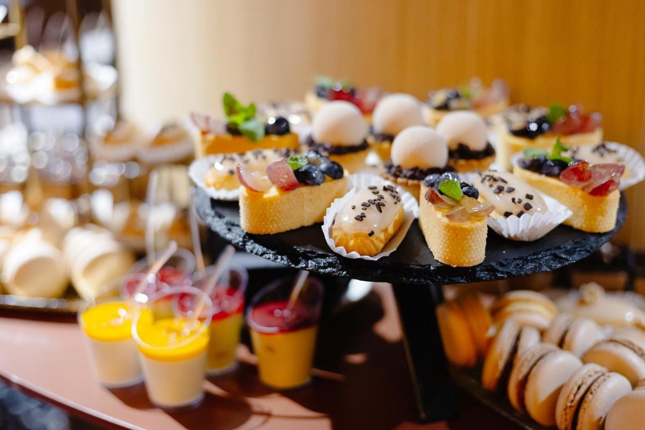 Emily Resort Lviv Bagian luar foto A selection of desserts